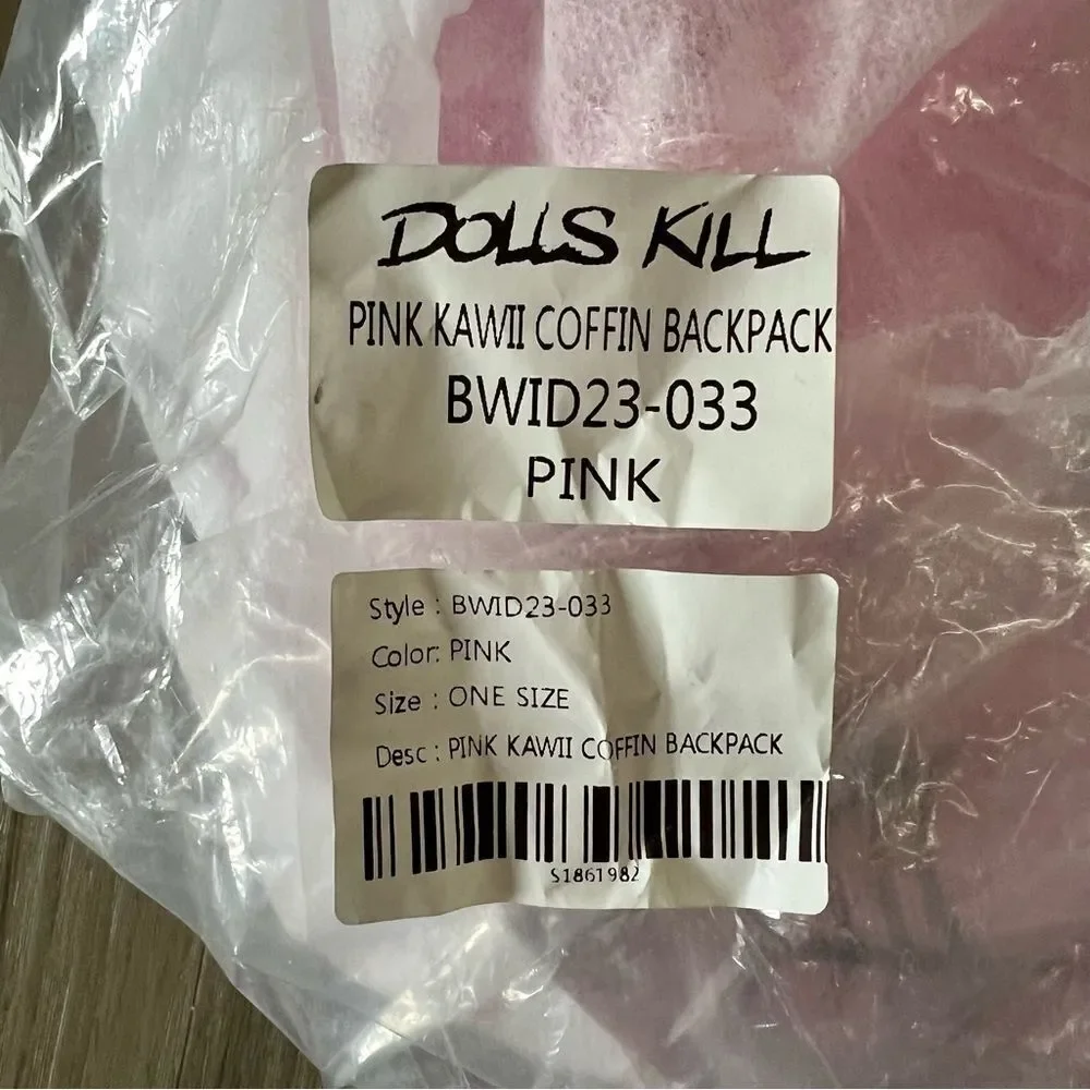Dolls Kill oversize pink and black skull spiderweb coffin backpack. New in box